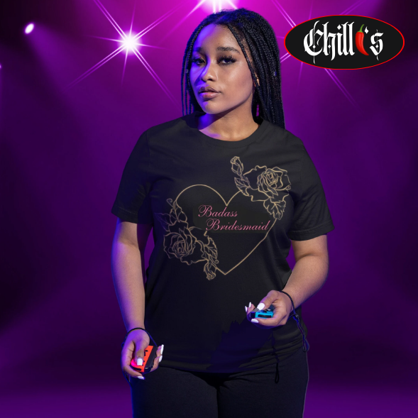 On the front of the shirt, you will find a stunning gold heart outline adorned with elegant gold roses on opposite sides.